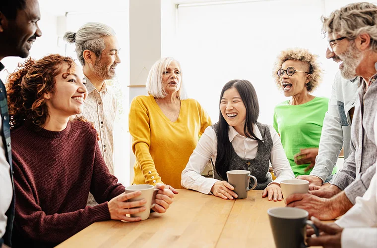 group of diverse people having coffee together