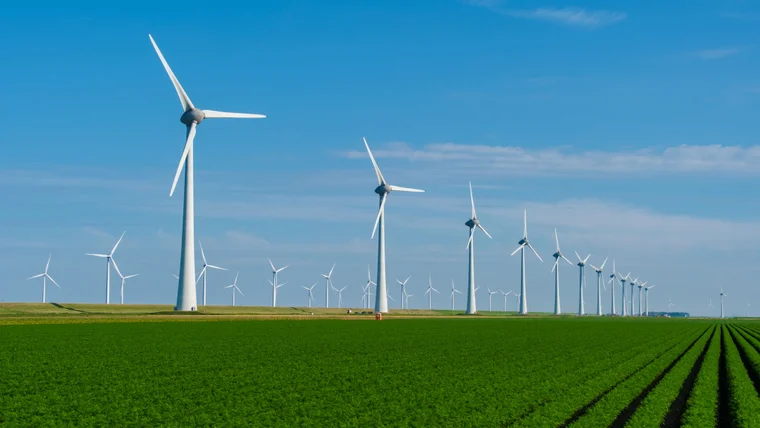windmills in large open grass field